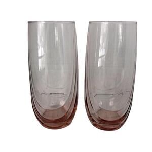 A pair of pink ribbed Libbey beverage glasses.